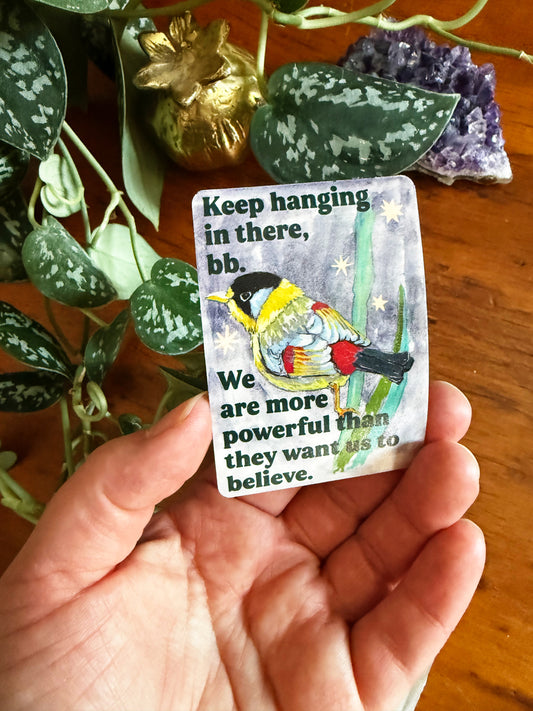 Keep hanging in there, bb. We are more powerful than they want us to believe: feminist sticker