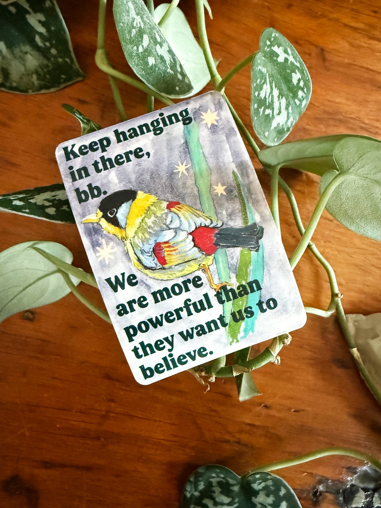 Keep hanging in there, bb. We are more powerful than they want us to believe: feminist sticker