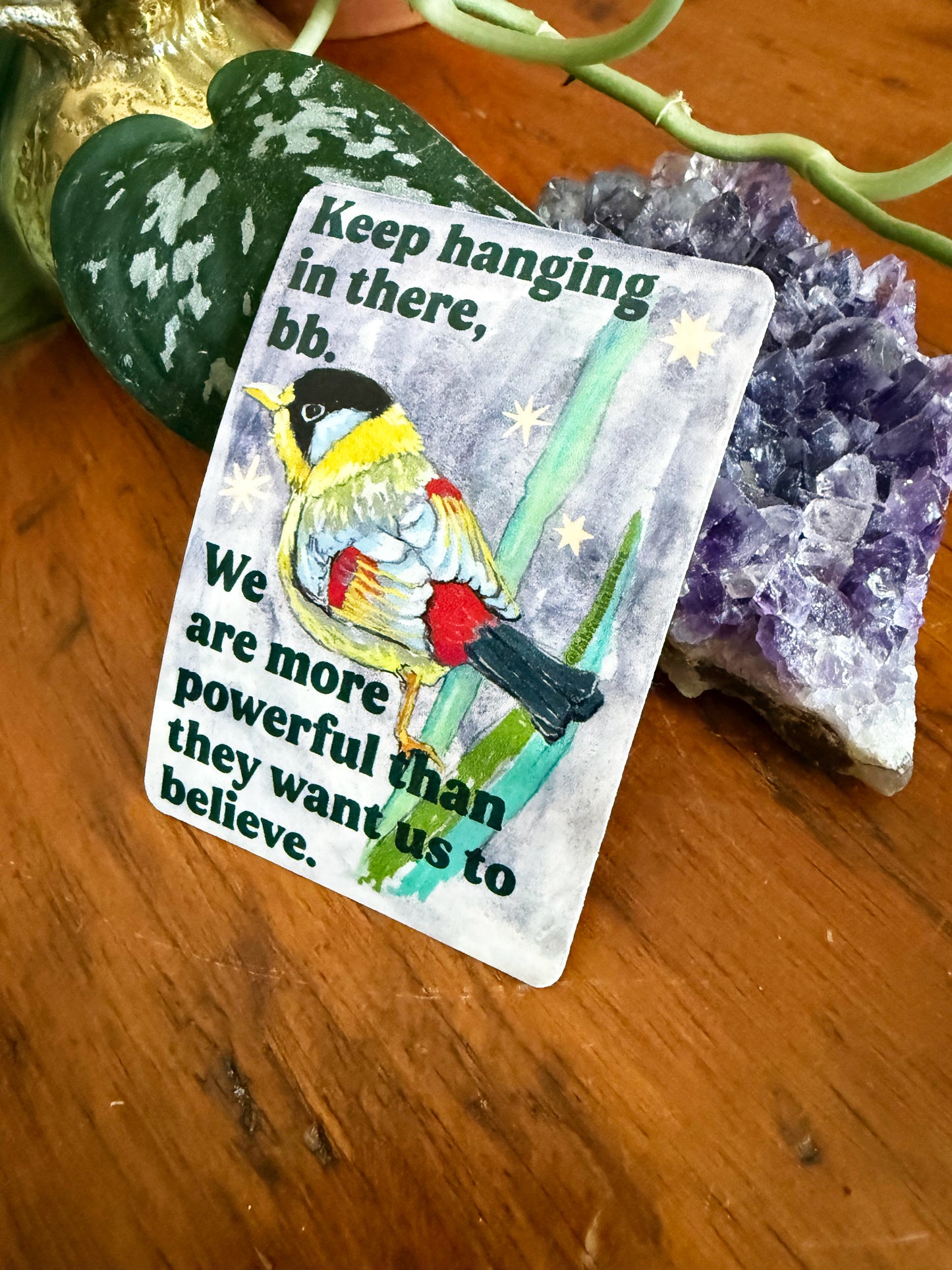 Keep hanging in there, bb. We are more powerful than they want us to believe: feminist sticker