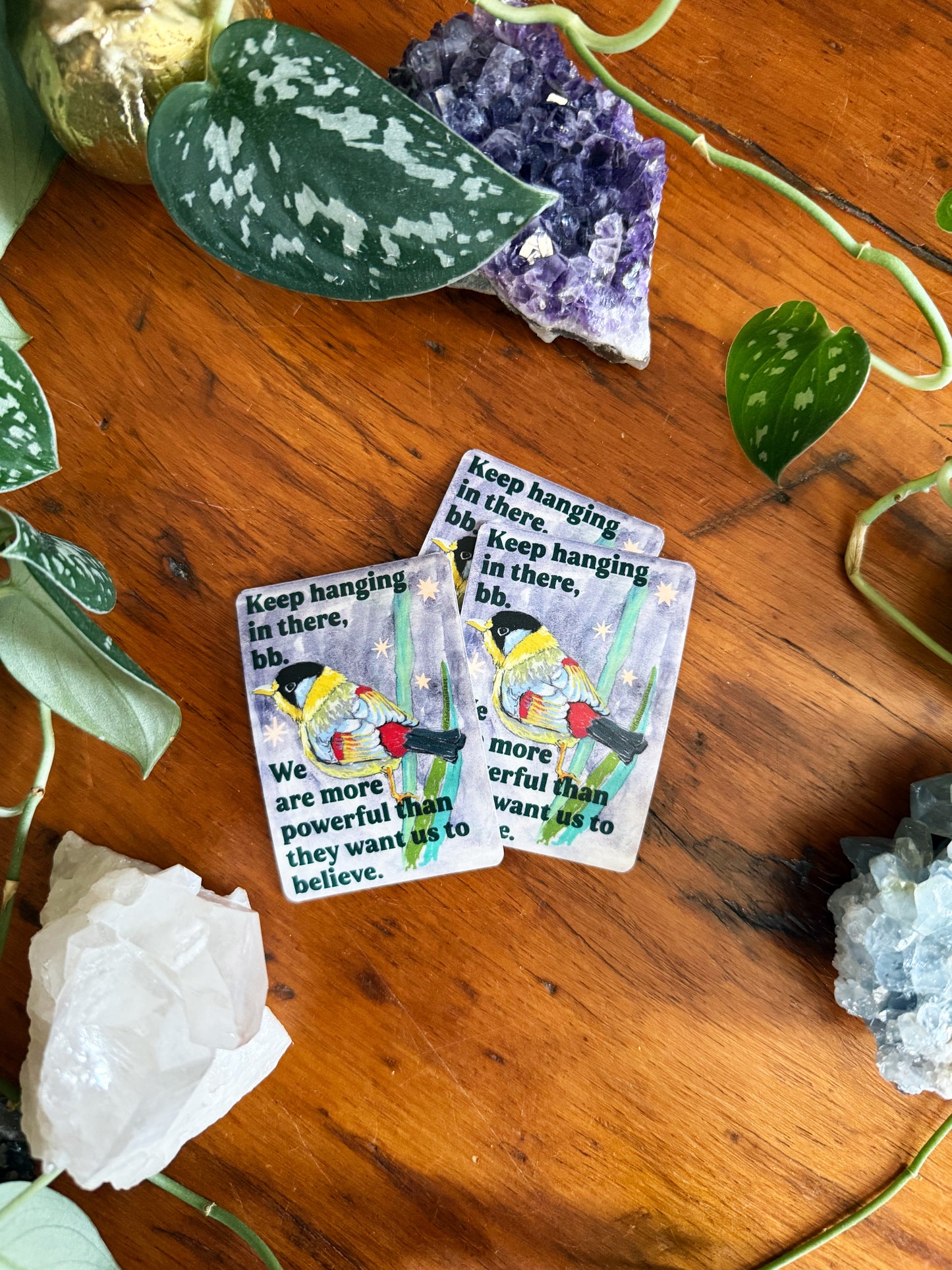 Keep hanging in there, bb. We are more powerful than they want us to believe: feminist sticker