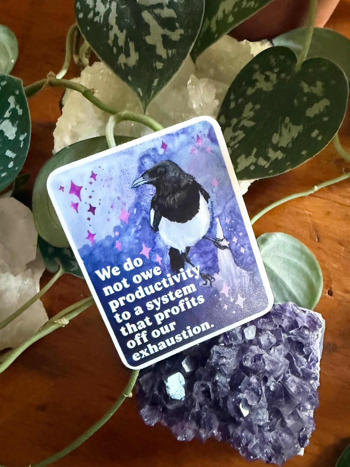 We do not owe productivity to a system that profits off our exhaustion: feminist sticker