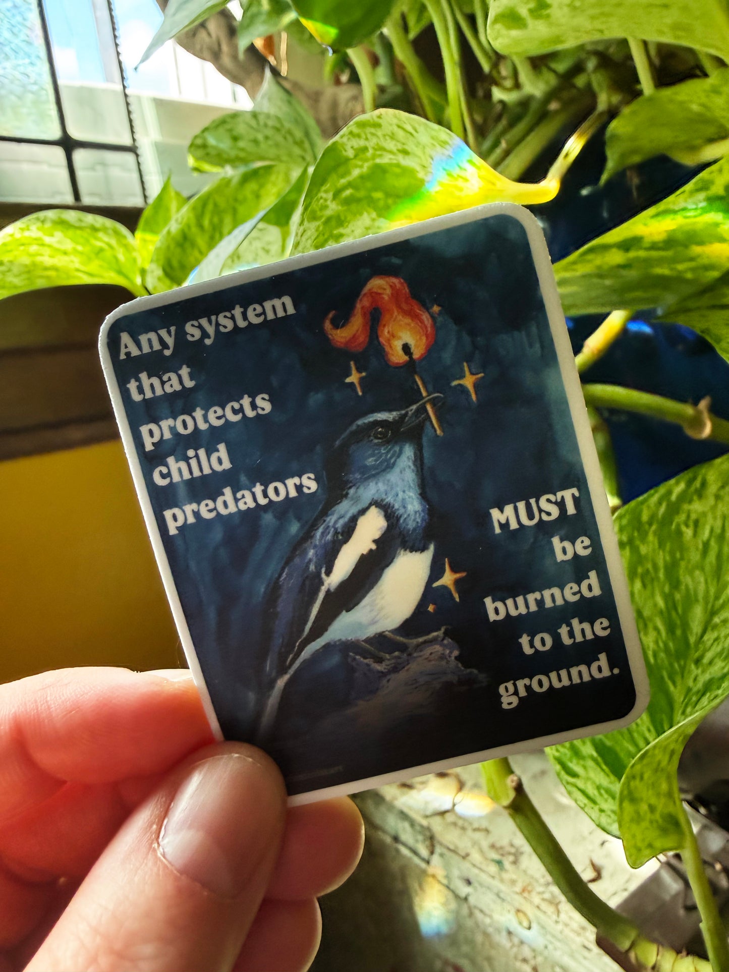 Any system that protects child predators must be burned to the ground: feminist sticker