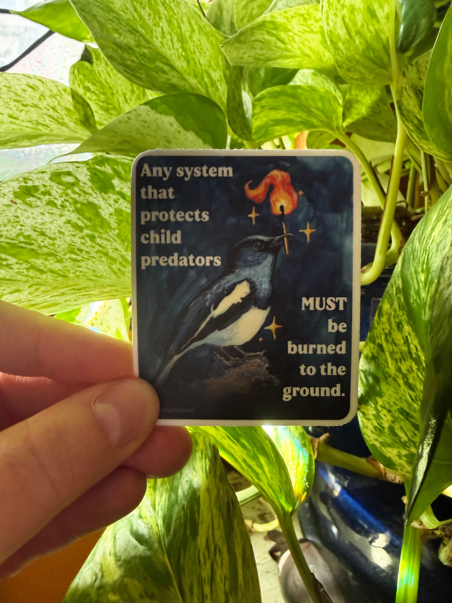 Any system that protects child predators must be burned to the ground: feminist sticker