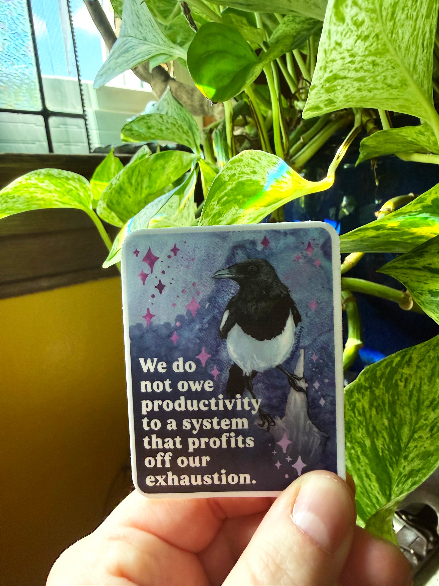 We do not owe productivity to a system that profits off our exhaustion: feminist sticker