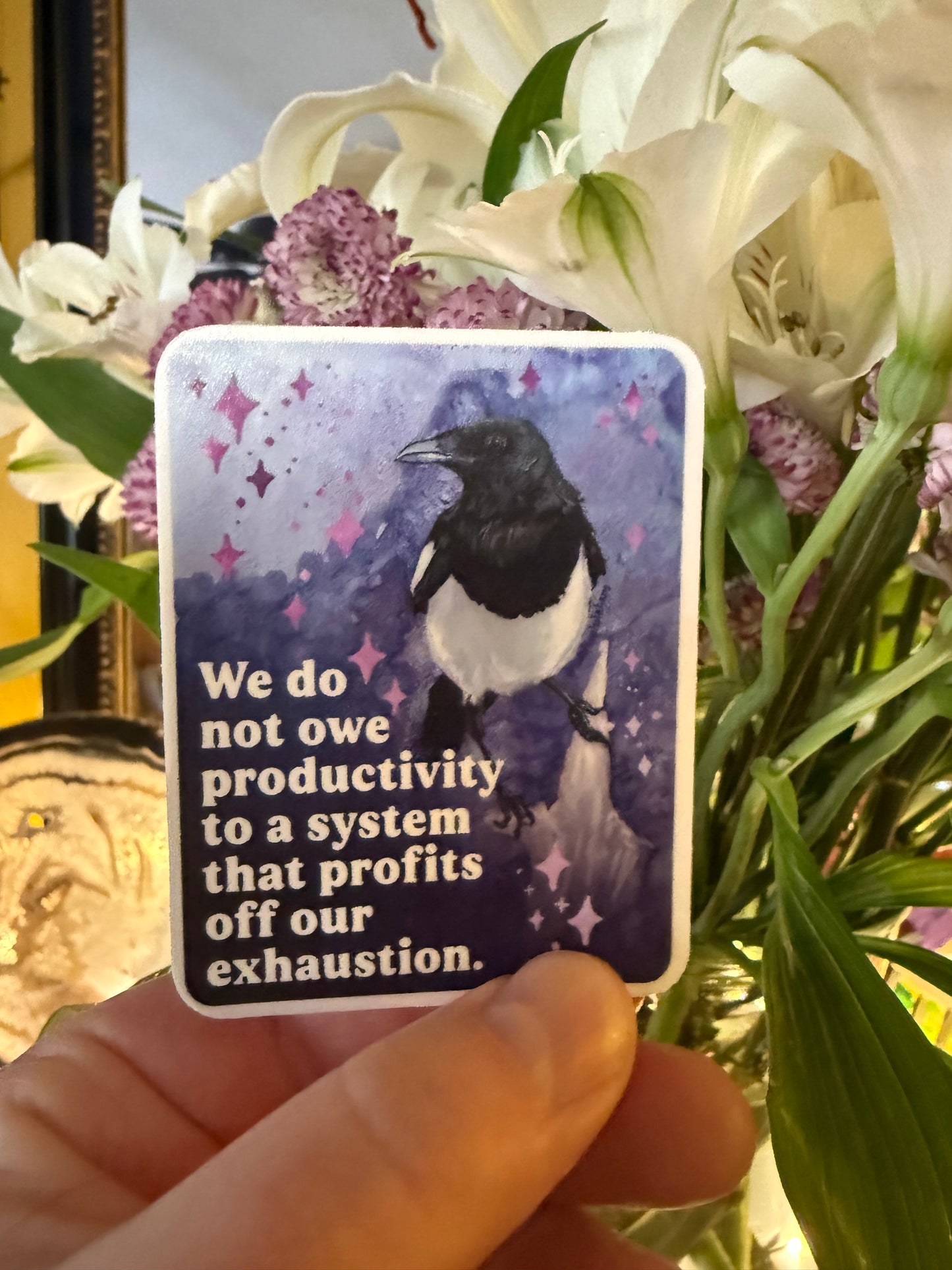 We do not owe productivity to a system that profits off our exhaustion: feminist sticker
