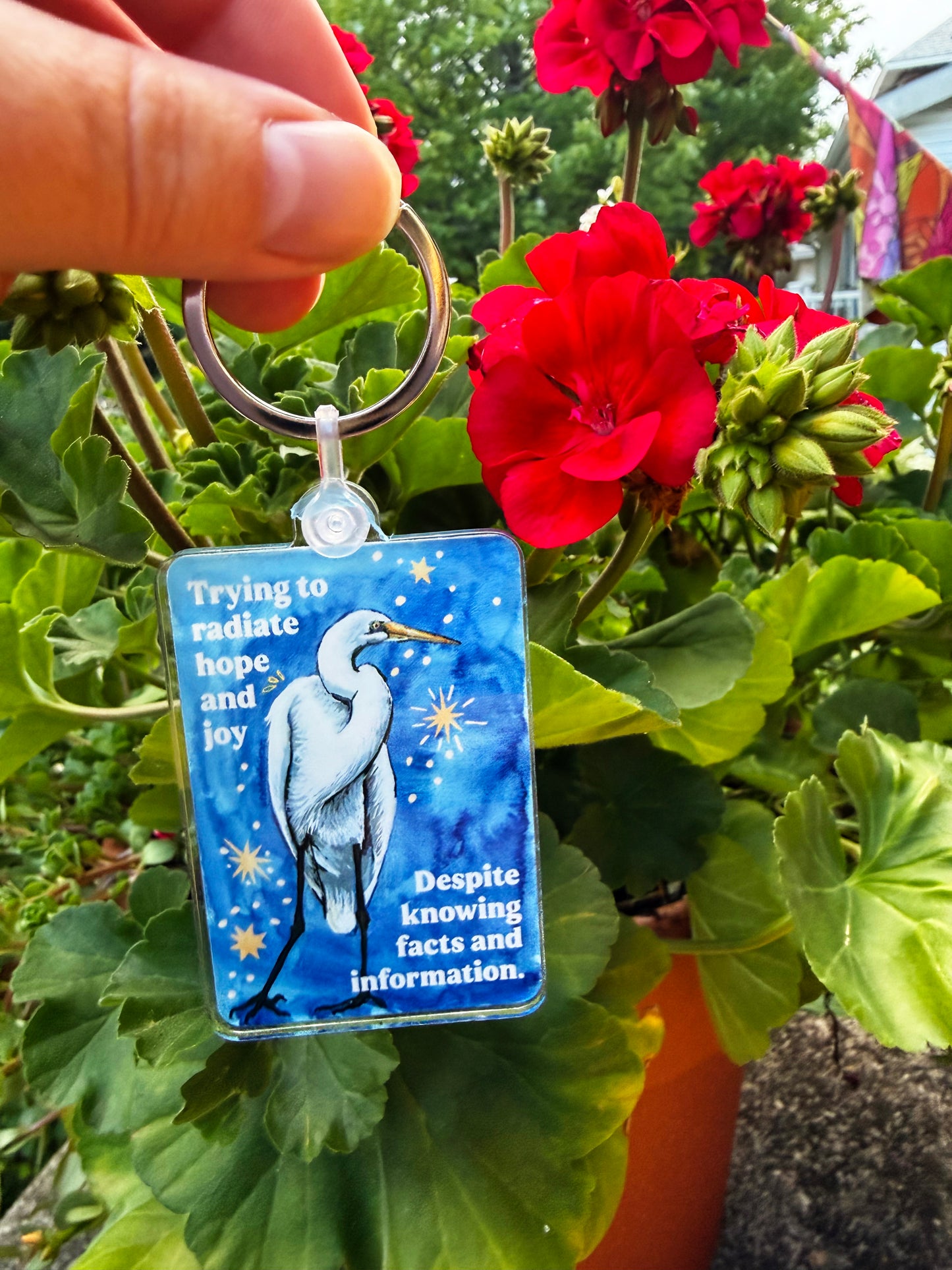 Trying to radiate hope and joy despite knowing facts and information: feminist keychain