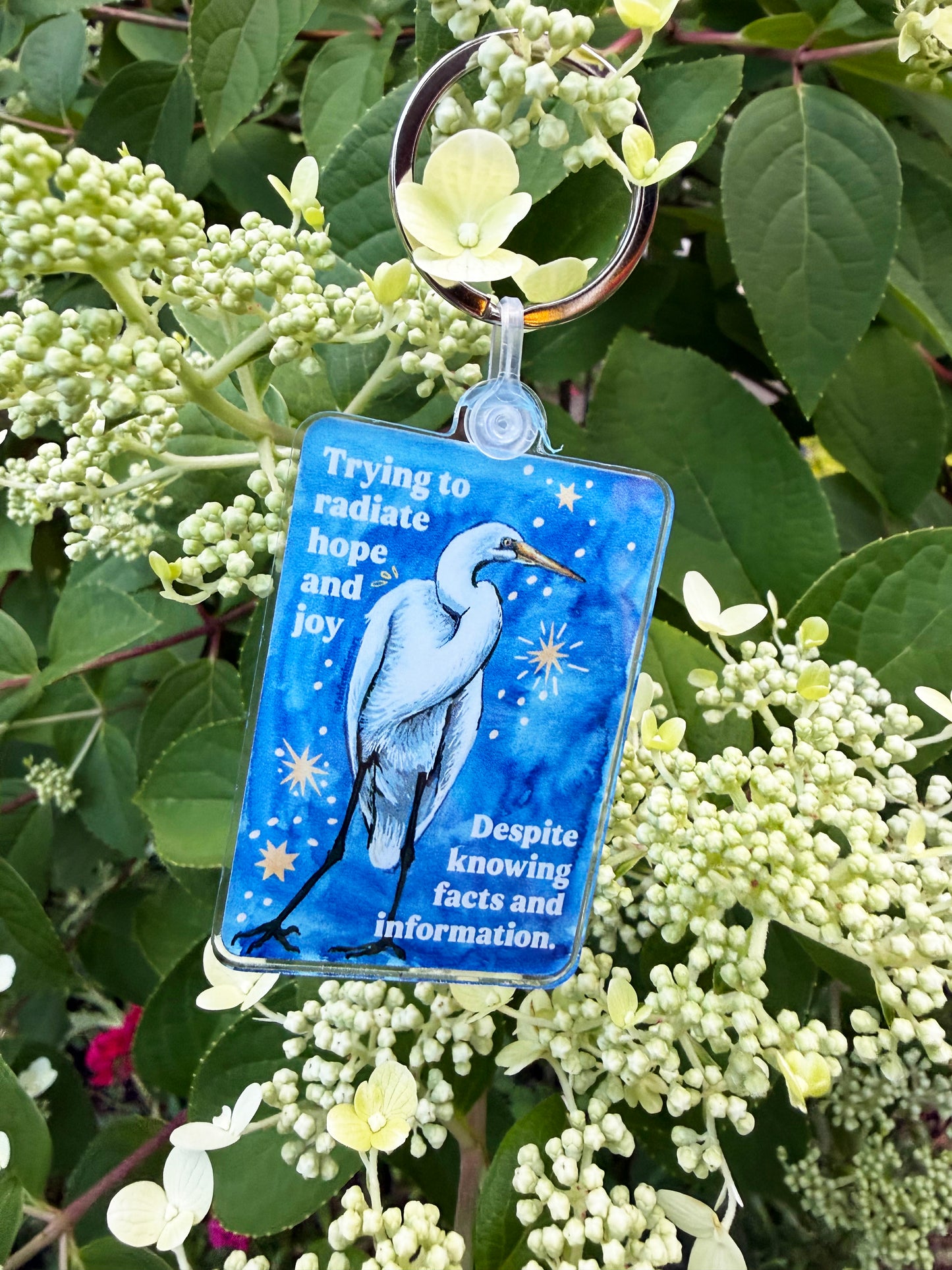 Trying to radiate hope and joy despite knowing facts and information: feminist keychain