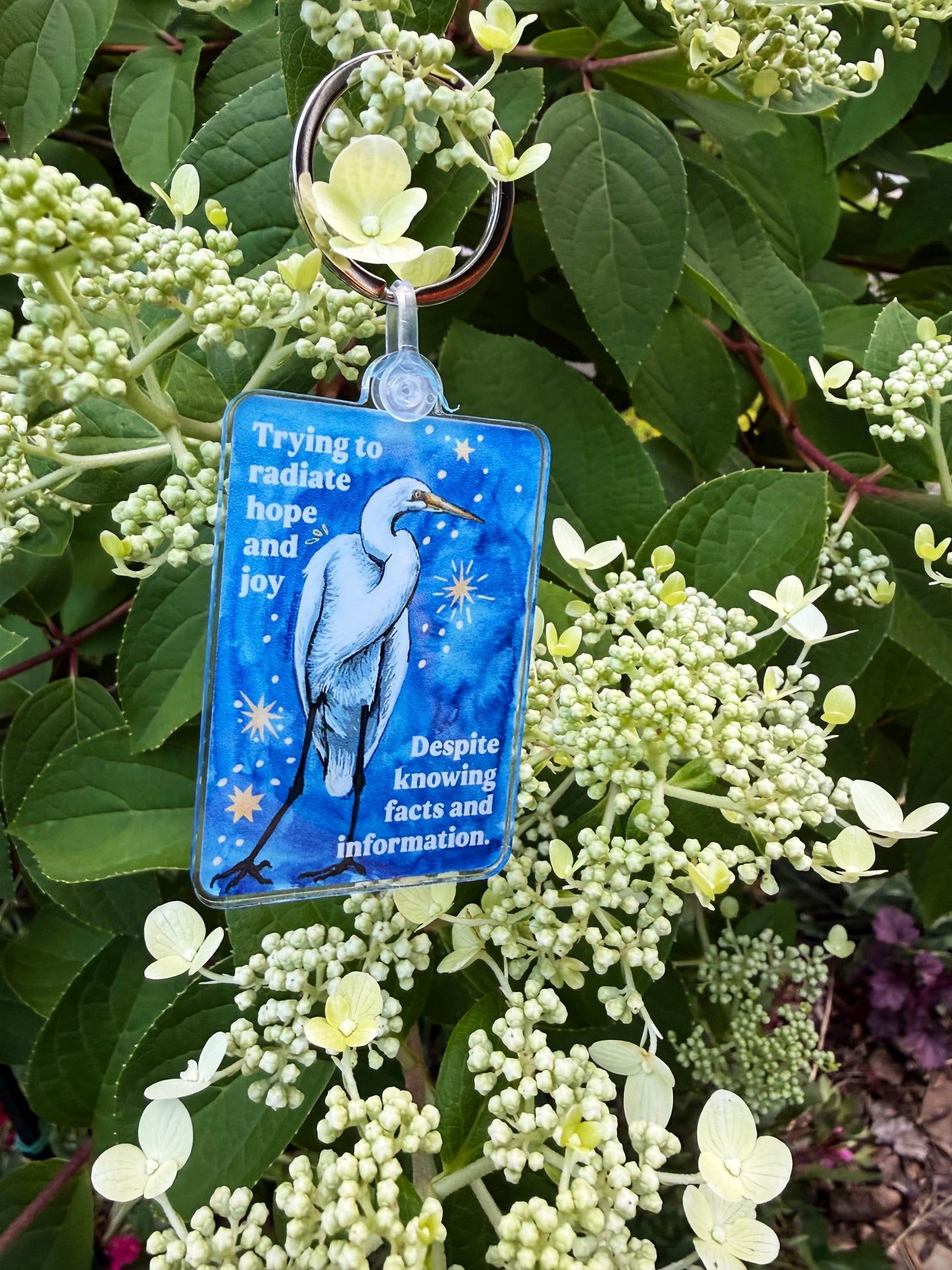 Trying to radiate hope and joy despite knowing facts and information: feminist keychain