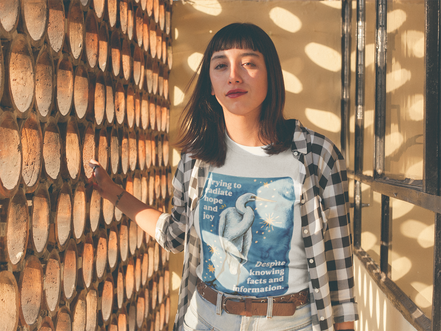 Trying to radiate hope and joy despite knowing facts and information: feminist shirt